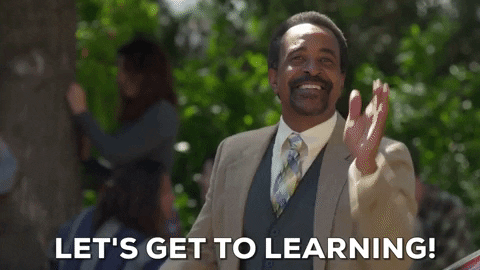 A Gif of ABC Network's The Goldbergs, of their principal, Mr. Glascott clapping his hands and the subtitles says "Let's get to learning!"