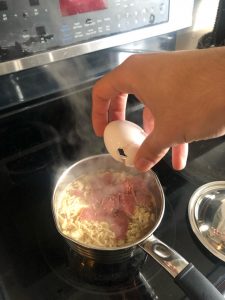 Egg being cracked with everything in