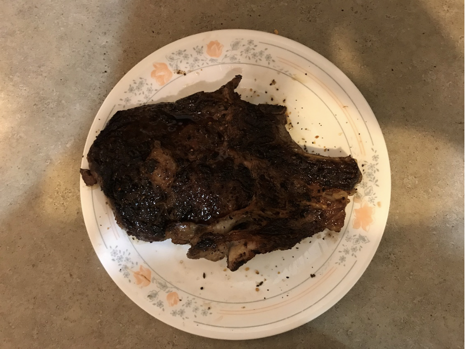 A cooked steak on a plate