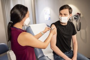 Photo of a person receiving a Covid19 vaccination