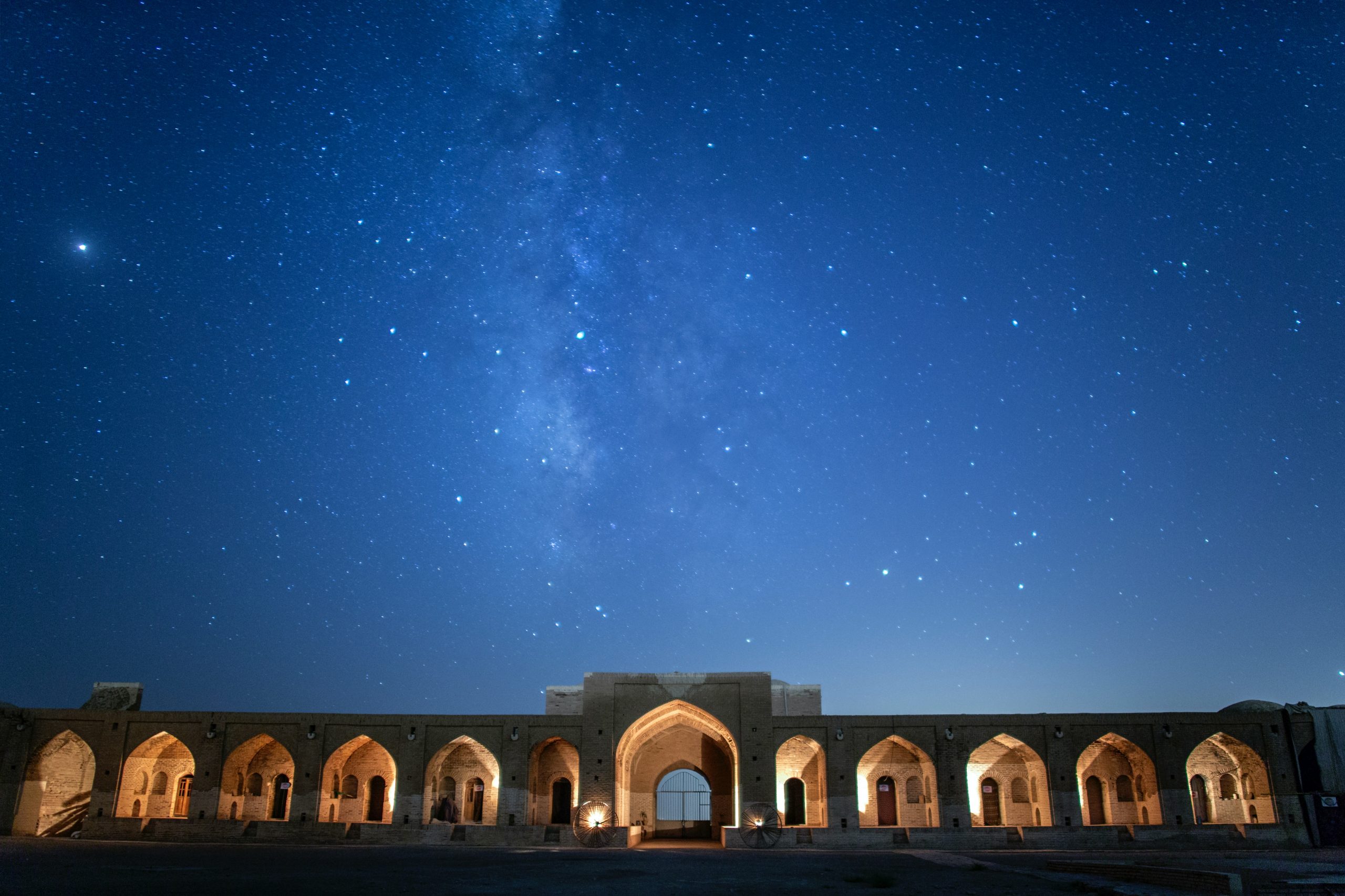 archway set against dark sky full of stars