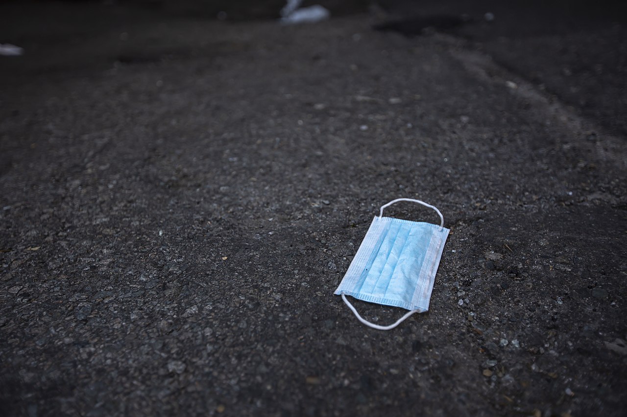 Medical face mask lying on the street.
