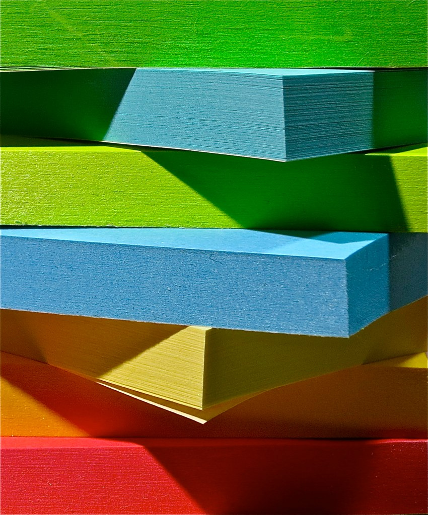 Colourful post-it notes stacked on top of each other.