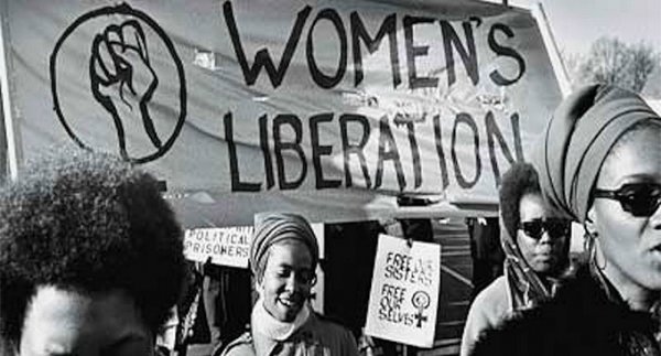 Women holding a Women's Liberation banner.