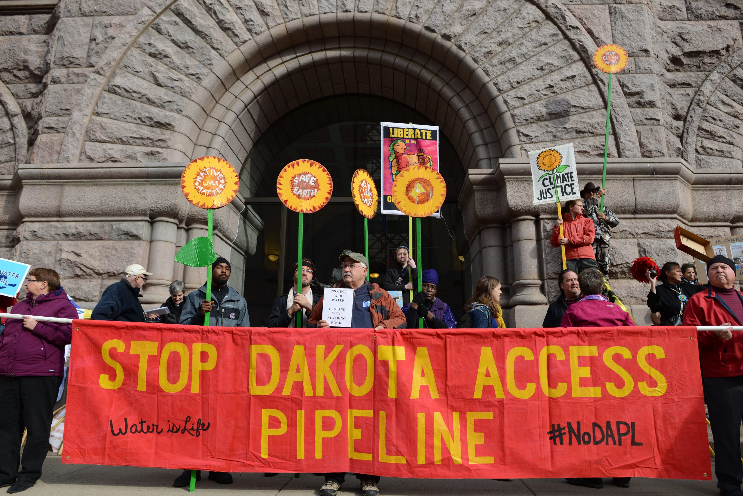Protesters holds Stop Dakota Access Pipeline banner