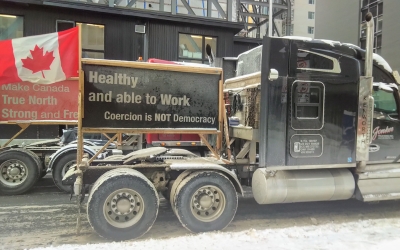 truck with Canadian flag and sign reading healthy and able to work, coercion is not democracy