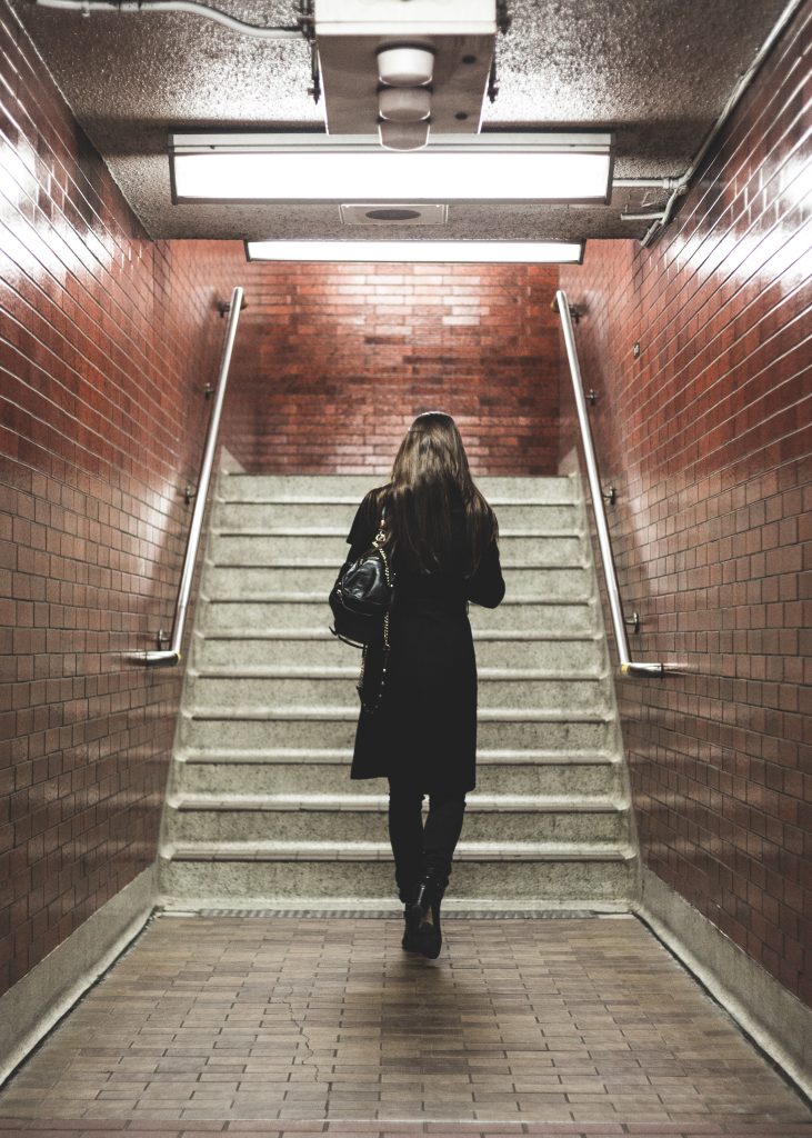 A woman alone in a stairwell