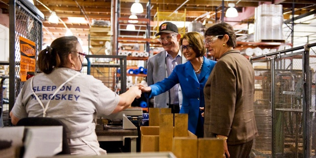 A small group of people touring a family-owned business